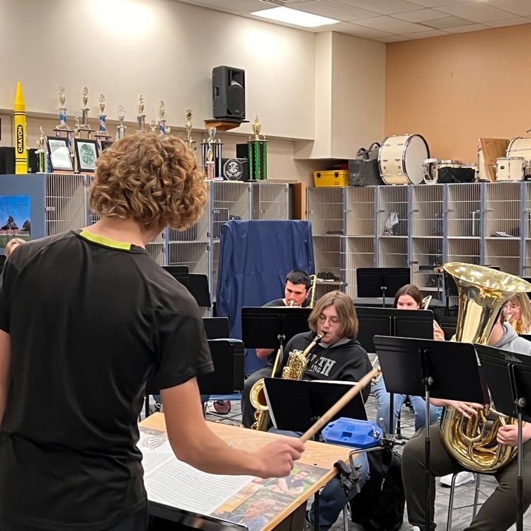 Landen G. conducts the Jazz Band as they rehearse a variety of holiday tunes.